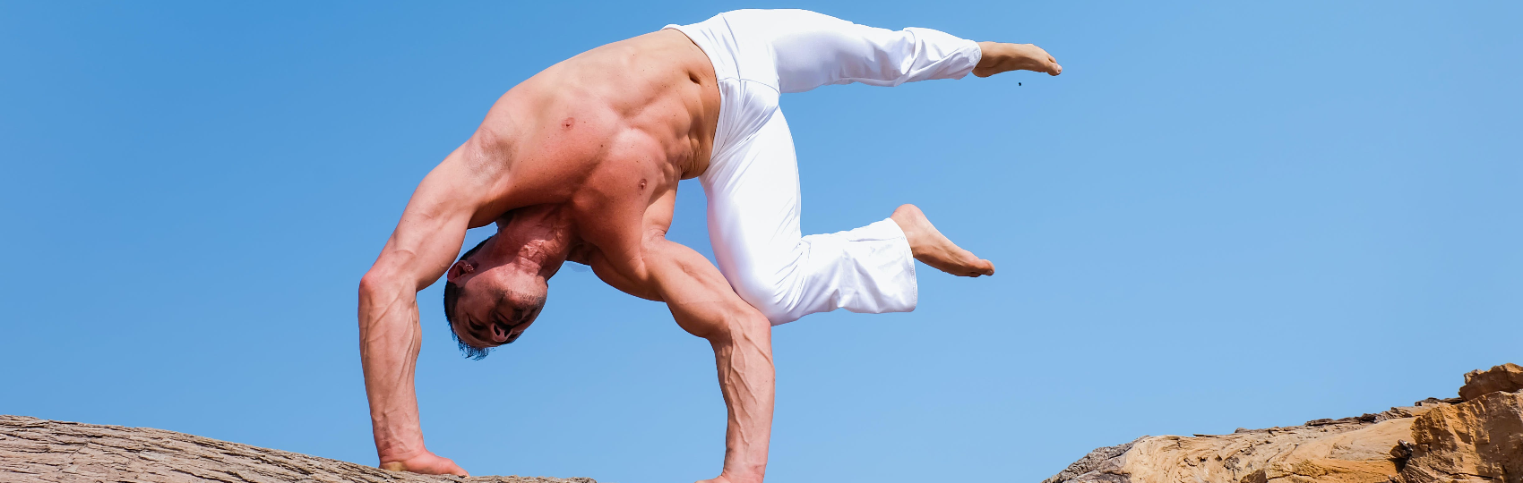 Man doing handstand outdoors